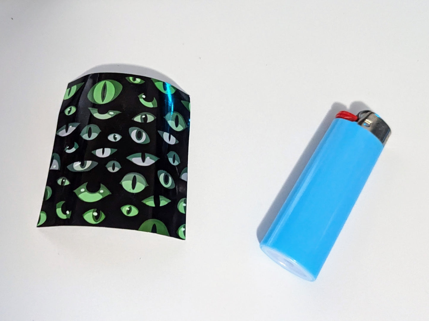 Patterned lighter wrap | customize your lighters | spooky Halloween pattern | eyes in the dark